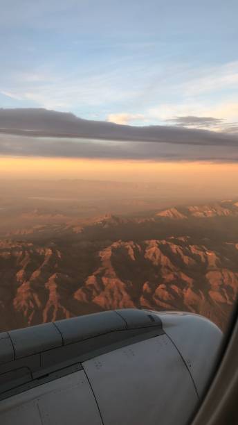 istock Window seat view - beautiful view from an airplane - sunset from a plane - mountain landscape 1473947425