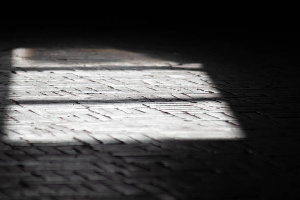 istock Frame of light from window on cobblestone floor 1473948526