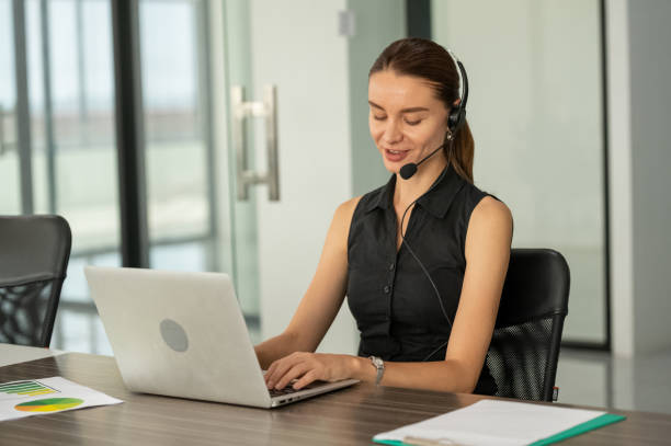 istock businesswoman using laptop conference with customer 1473949275