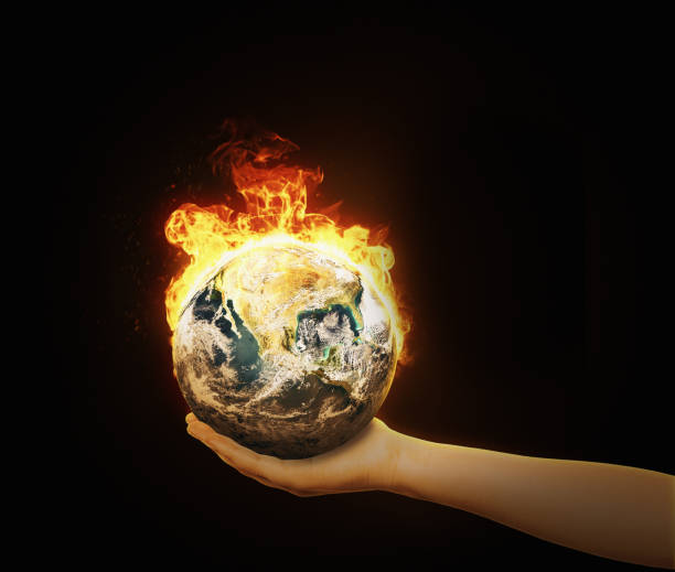 istock Environmentalist supports burning Planet Earth on her hand: she cares about climate change 1473949533