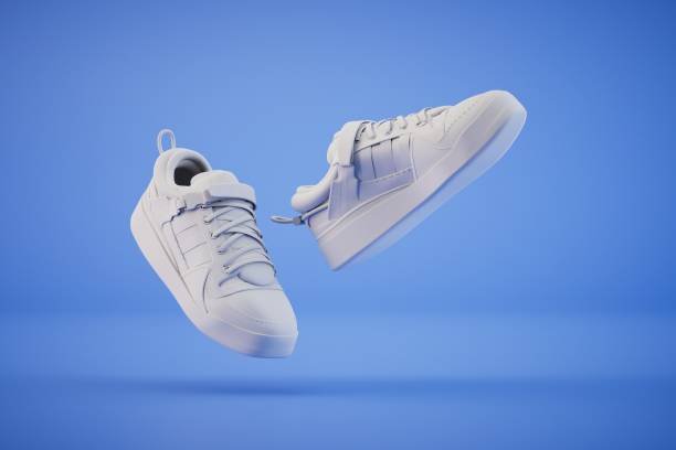 istock fashionable white sneakers flying on a blue background. 3D render 1473950245