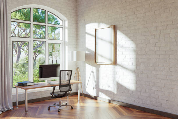istock comfortable workplace with pc standing on wooden desk in office at home; bright sunlight shines from side through large window; wall with canvas copy space;  remote work freelance concept; 3D Illustration 1473951251