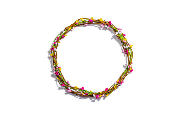 Easter wreath isolated on white background. Artificial floral decor, traditional festive symbol. Trendy hard light, dark shadow, top view, mockup, template, flat lay