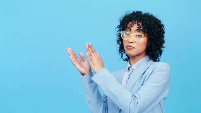 Portrait, applause and motivation with a business black woman on a blue background in studio for celebration. Winner, achievement and recognition with a female employee clapping in support of success