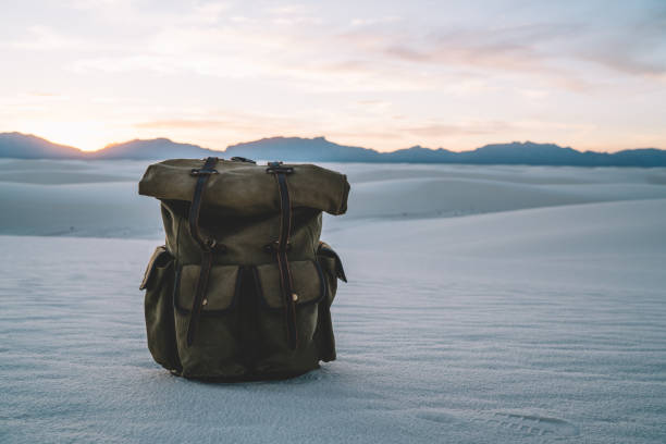 istock Travel bag on white sand in national park 1473957772