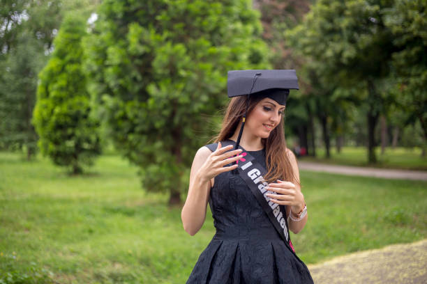 Happy woman on her graduation day . Education and people.