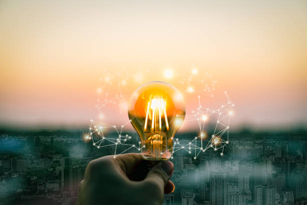 istock Hand business man holding light bulb with light line. Alternative energy, idea, saving electricity innovation and inspiration concepts. 1473960640