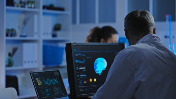 istock Male laboratory worker examining brain mri on display, conducting diagnostics 1473960677