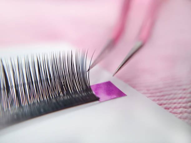 close up of eyelash extensions in beauty salon macro eye , close up of eyelash extensions in beauty salon macro eye ,2d volume 3d volume,russian volume, classical style, remover,patches,lash technician,beautician,lashmaker,cat eye clump eyelashes stock pictures, royalty-free photos & images