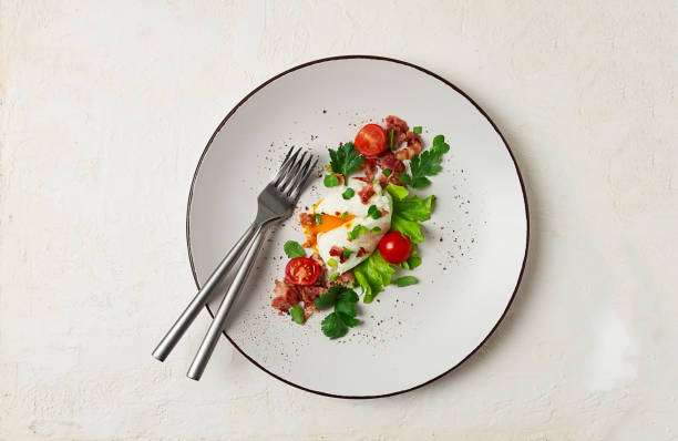 istock poached egg, with bacon and vegetables, breakfast, homemade, 1473961700