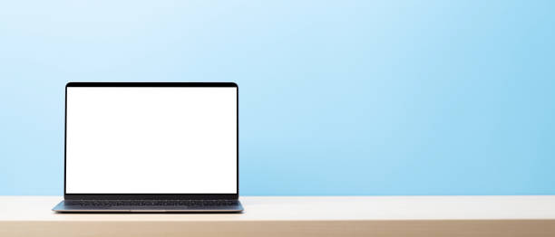 istock Laptop with blank screen on wooden table 1473962327