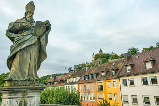 St.Bruno became a bishop in 1033, and was known for starting parishes throughout Würzburg on Old Main (pedestrain) bridge. Marienberg fortress behind. Capella church  also behind  a little