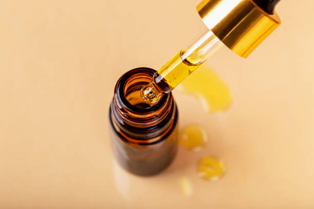 istock Amber bottle with dropper on beige background 1473963947