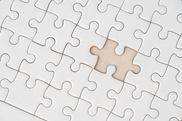 istock White jigsaw puzzle background for business concept of strategy solution 1473963959