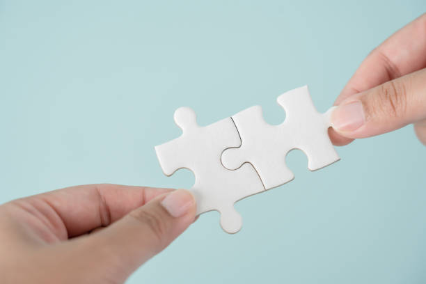 istock Partnership, business strategy concept using human hands and jigsaw puzzle pieces 1473964305