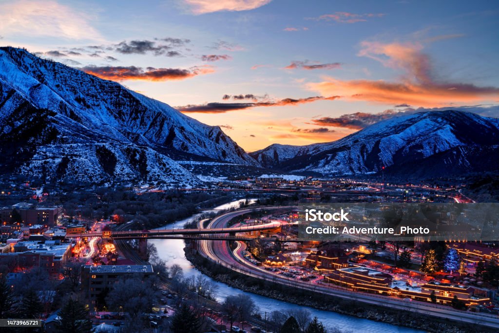 Glenwood Springs at Dusk with Colorado River View Glenwood Springs at Dusk with Colorado River View - Colorado River flowing through the heart of Glenwood Springs Colorado at dusk during blue hour. Sunset skies. Colorado Stock Photo