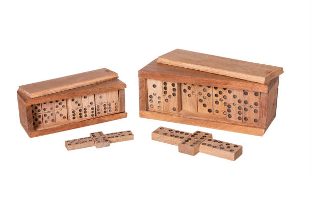 istock dominoes in wooden case on white background 1473969733