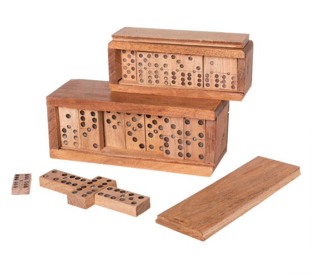 istock dominoes in wooden case on white background 1473969734