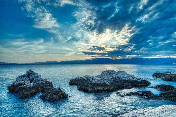 Beautiful sunset above the sea with nice sky with clouds