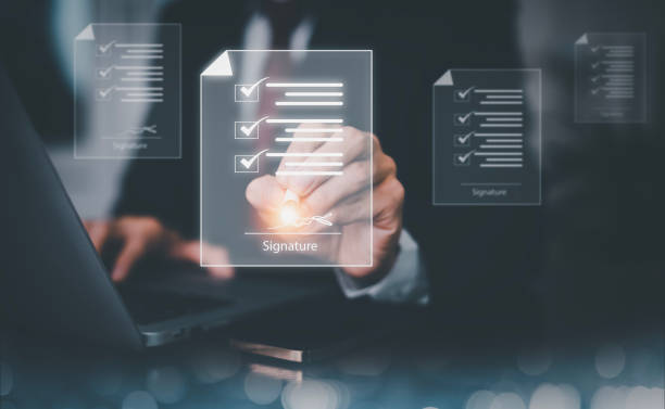 istock Signing electronic documents on digital documents Online, businessman with contract Electronic signature, e-signing, digital document management, paperless office, signing business contract concept, 1473971173
