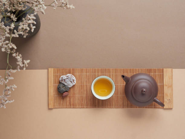 istock Teapot and cup of tea near stone 1473971945