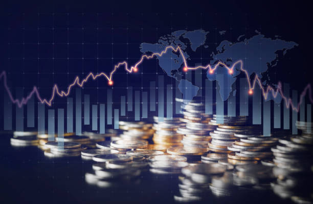 istock Double exposure image of coin stacks on technology financial graph background. 1473972095
