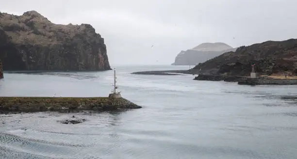 Photo of Landscape with the breakwater at the entrance of Vestmannaeyjar