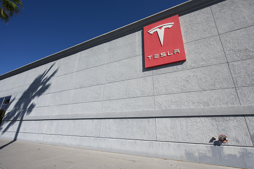 Jacksonville, Florida - March 16, 2023: Tesla sign on building located on River City Drive in Jacksonville, Florida.
