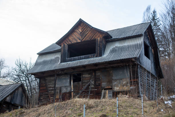 istock Old unfinished wooden house 1473982576