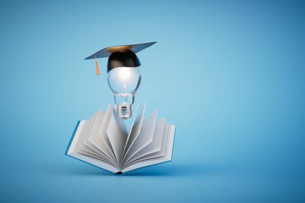 istock ideas for higher education. an open book and a light bulb in the master's cap on a blue background. 3D render 1473982729
