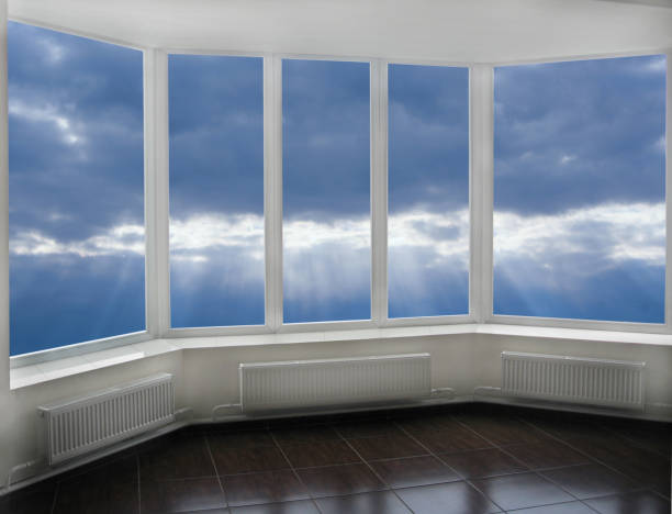 istock Window with view to sunset with dark cloud. Thunder-storm clouds panorama 1473988460