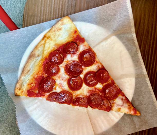 istock Slice of pepperoni pizza 1473988639