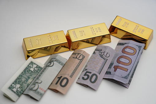 gold bullion and dollars. The downturn of the dollar and the economy. dollar and gold prices