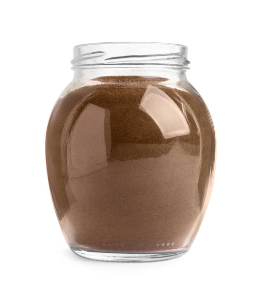 istock Glass jar of instant coffee isolated on white 1473989437