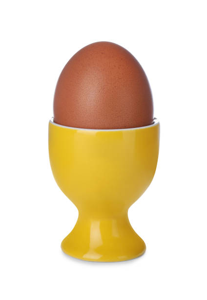 istock Cup with unpeeled boiled egg isolated on white 1473989820