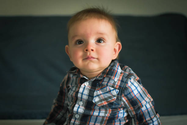 istock Cute baby in checkered shirt 1473989975