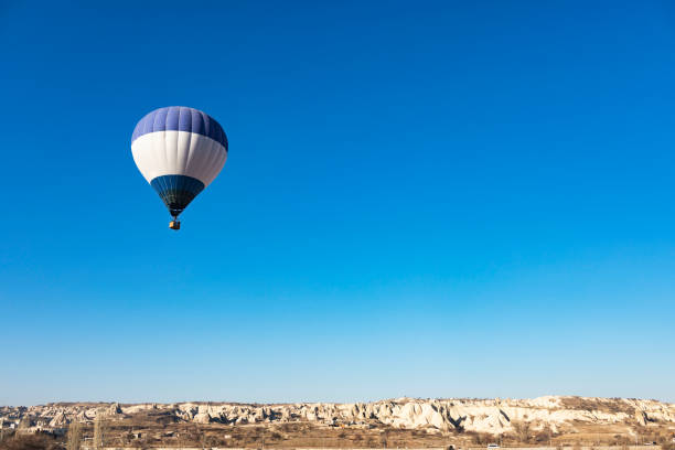 Free Stock Photo of Large Hot Air Balloon Flying Through Blue Sky ...