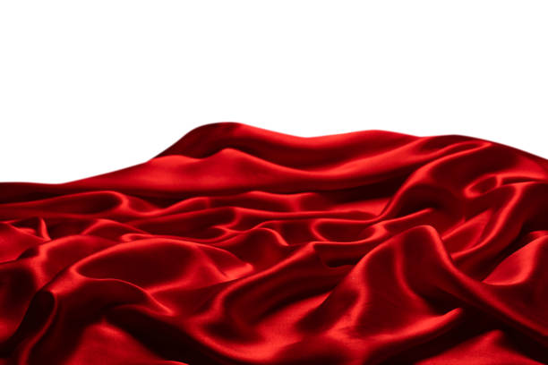 istock Red silk or satin luxury fabric texture isolated on a white background. 1473991374