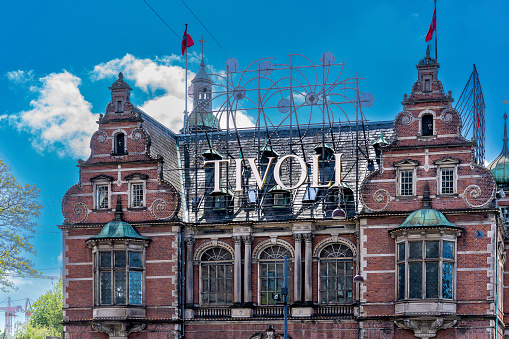 Copenhagen, Denmark - May 15, 2022: Founded in 1843, Tivoli Gardens is one the oldest theme parks in Europe and is said to have served as the inspiration for Disneyland. It's located in central Copenhagen next to the Central Rail Station.