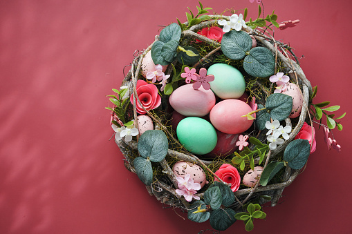 Easter Decoration with Easter Wreath and Eggs on Rustic Background