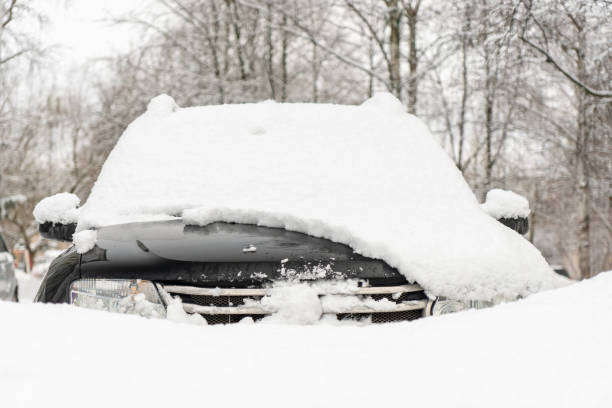 istock car windshield under a layer of snow, winter frozen car window 1473994686