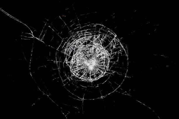 istock Glass broken by an impact, with black background. 1473994703