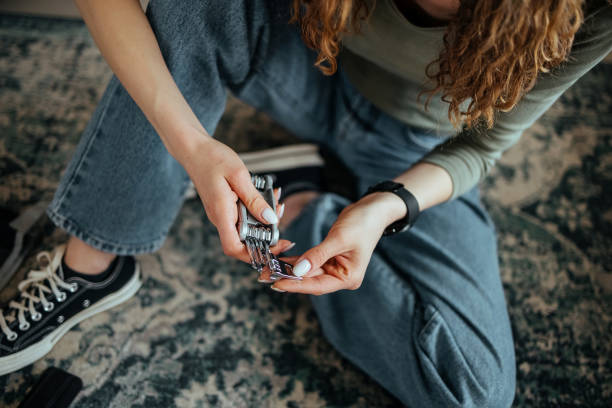 istock An unrecognizable person is sitting on the floor 1473995847