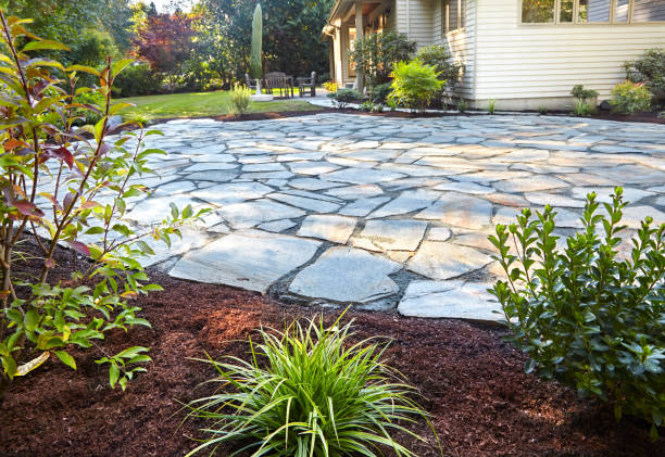 istock Newly planted beds by stone patio 1473997558