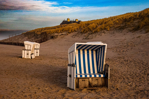 Sand dunes on both sides of natural path to blue Baltic Sea