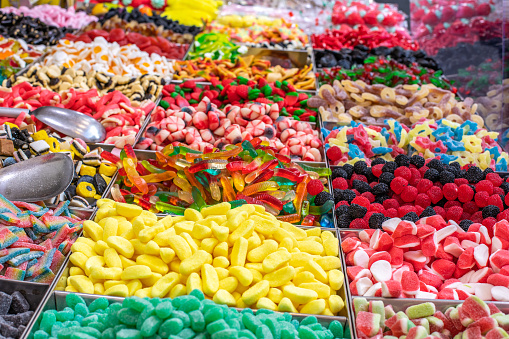 Pile of colorful gummy candies, jelly candy shop. Sweet candies. Street food