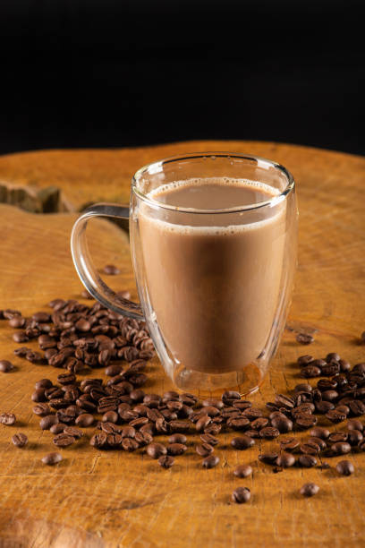 istock Glass cup, glass cup with milk and coffee on rustic wood, selective focus. 1474002004