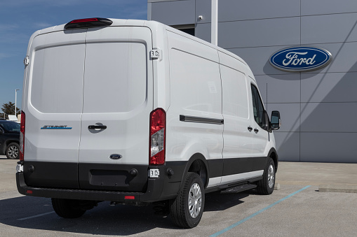 Indianapolis - Circa March 2023: Ford E-Transit Cargo Van display at a dealership. Ford offers the E-Transit in Cargo Van, Chassis Cab or Cutaway models.