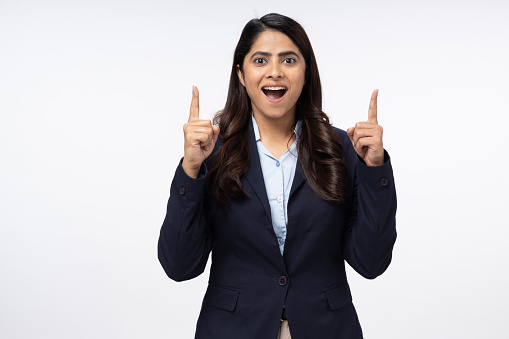 photo of cheerful positive woman pointing up for social media isolated white background