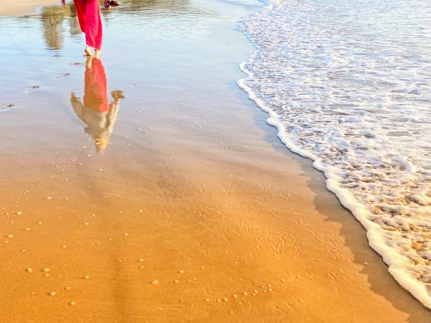 istock One person walking on the beach 1474006131